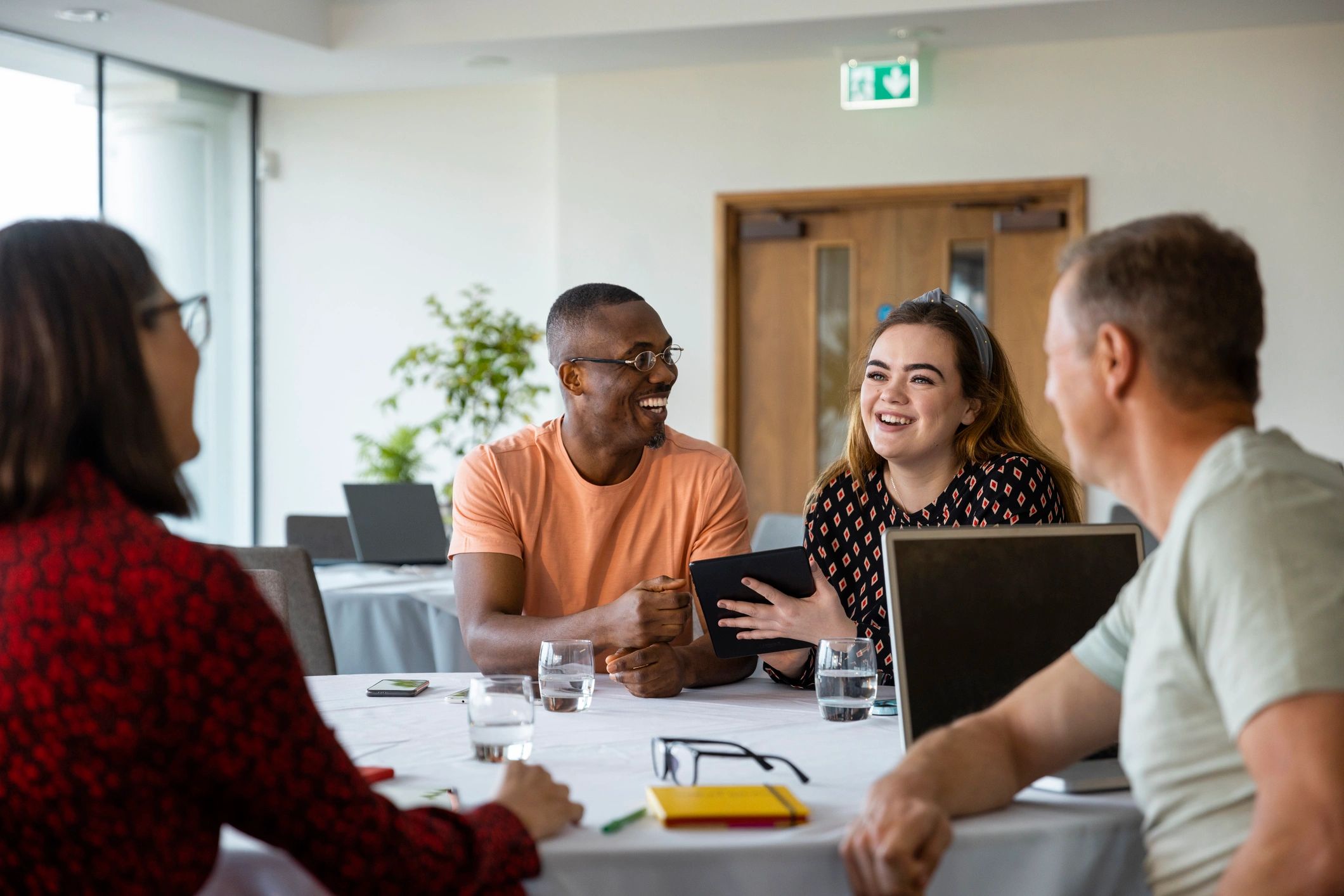 Researchers and professionals discussing ideas together