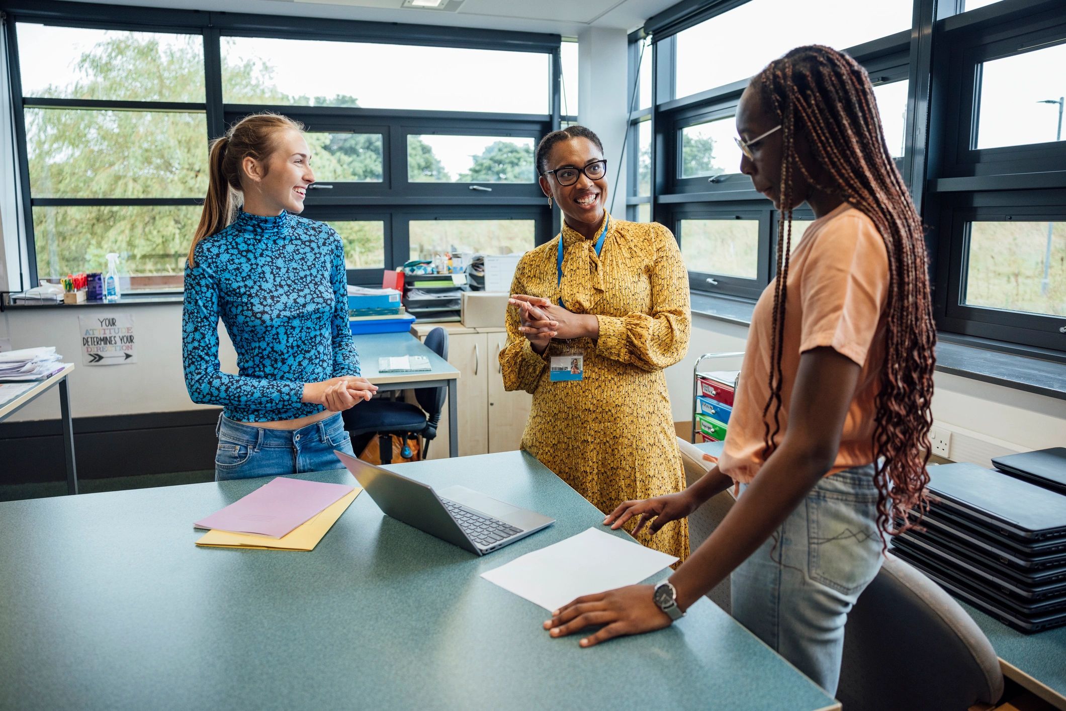 Teacher supporting students in classroom discussion