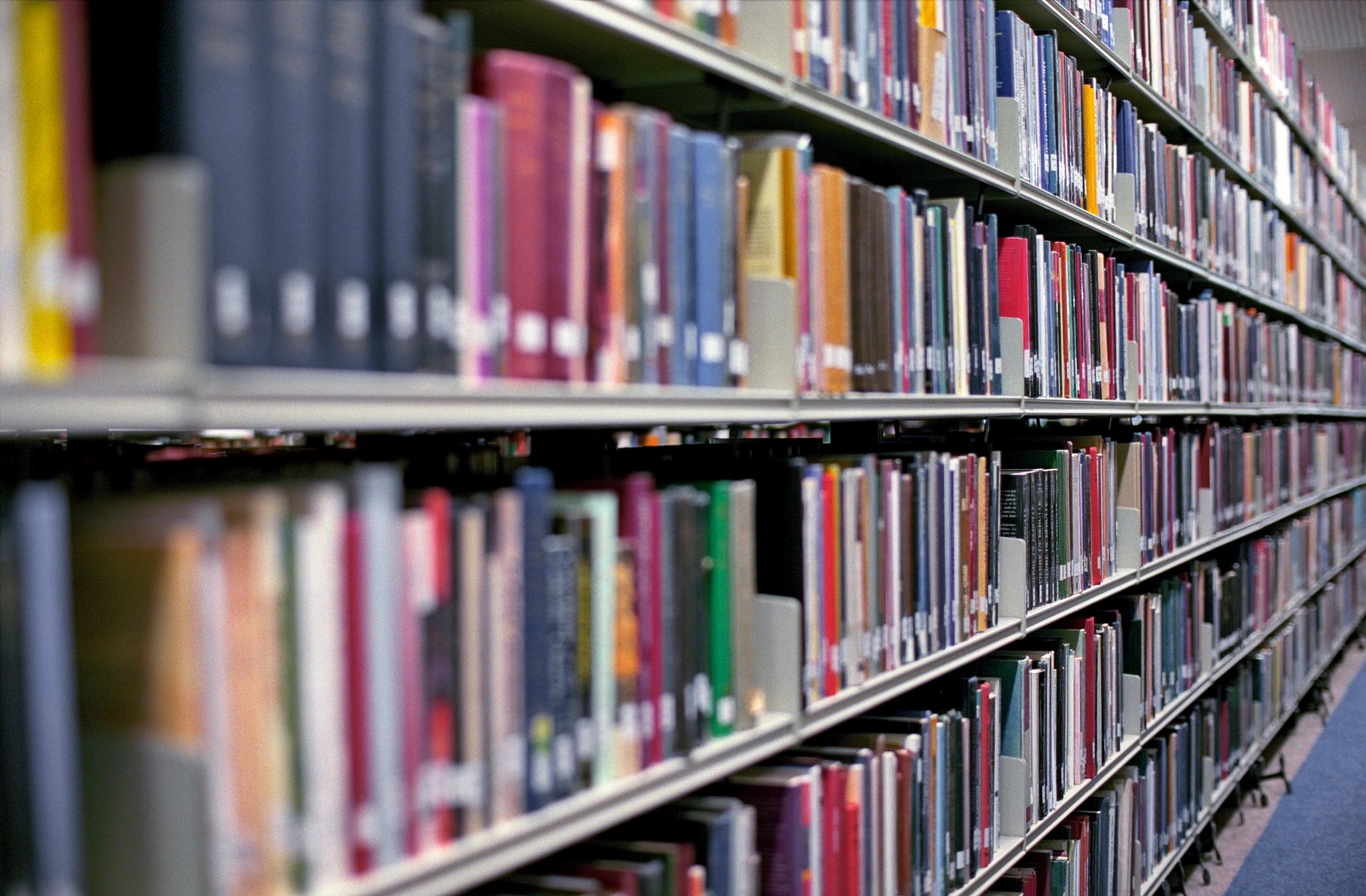 Rows of books representing scholarship and archival research