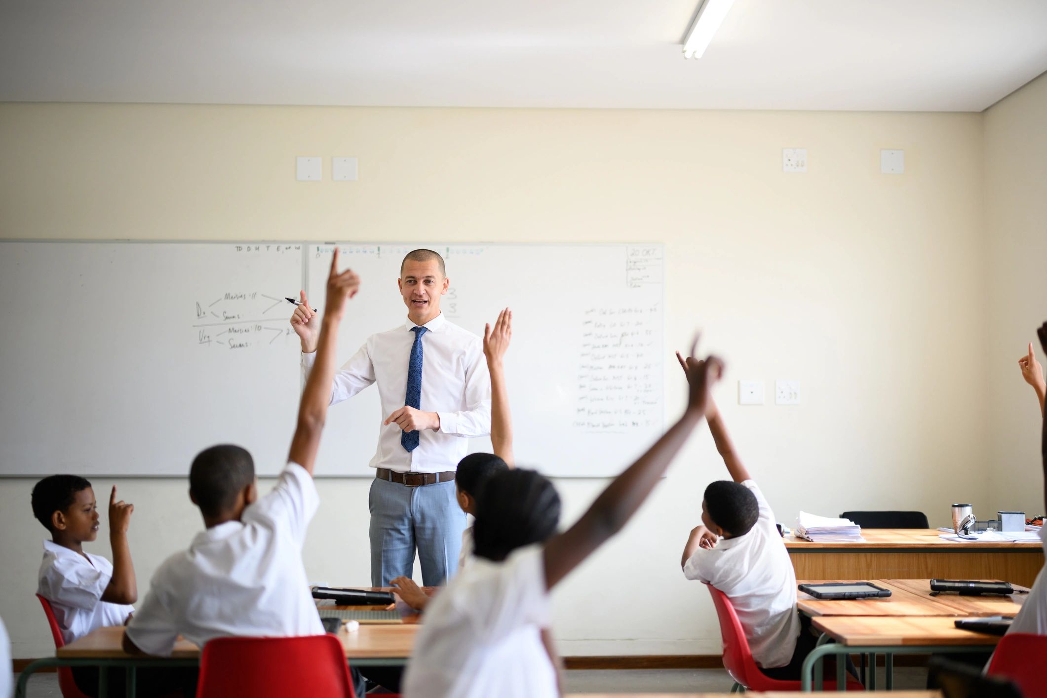 Teacher leading students in class