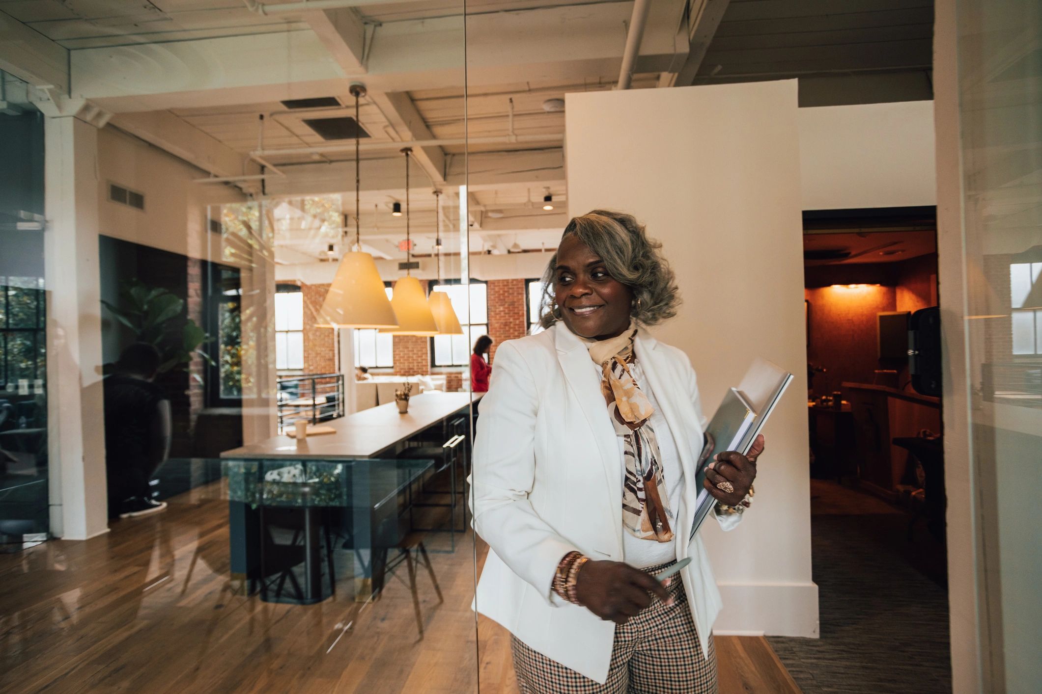 Professional Black woman in a corporate setting representing educational leadership