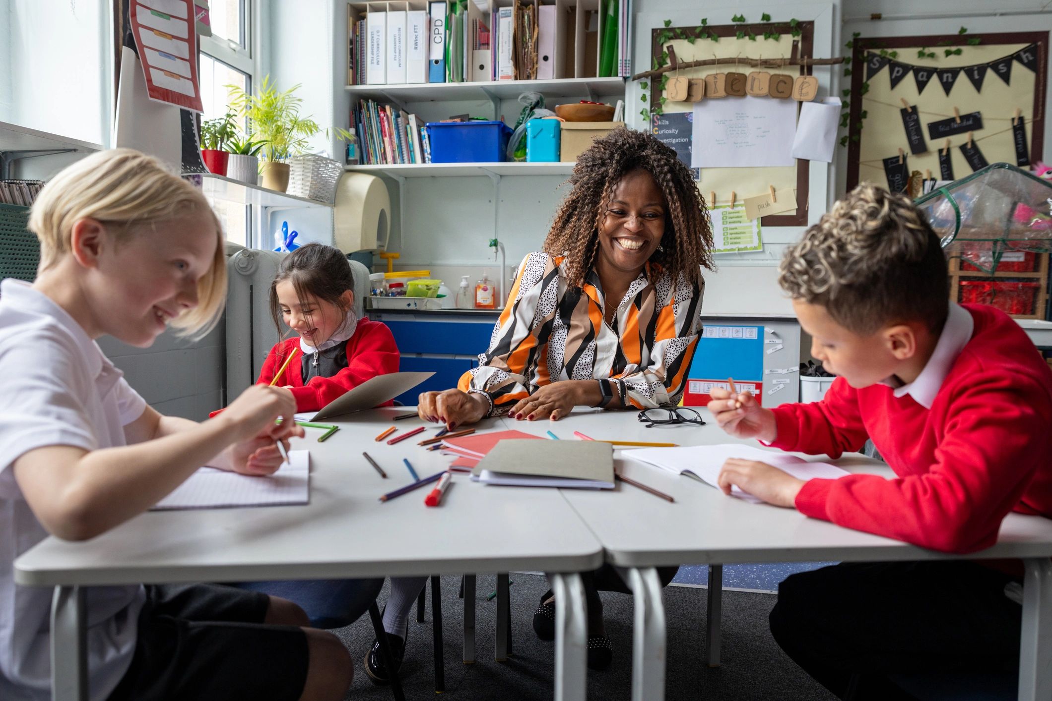 Teacher leading students in a collaborative classroom discussion